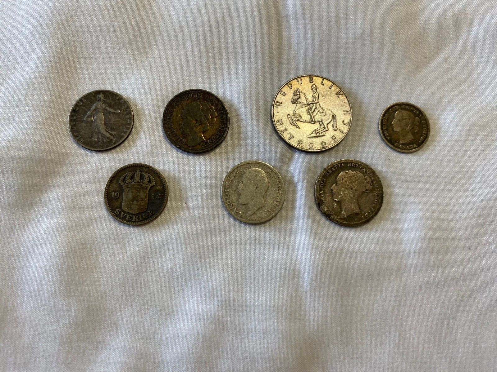 Group Of 7 Old Foreign Silver Coins – 1884, 1885, 1910, 1914, And More