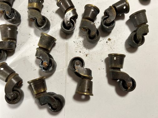 Group Of 20 Round Antique Or Vintage Brass Furniture Casters, used, in “as found” condition. It is possible that some of these may be unused, but I am listing them as used to be safe. We know absolutely nothing about old furniture hardware, so please view the images for condition and details. No returns. Each measure approximately 1-1/2” Long x 1” Wide x 2” High. Please email us with any questions you may have.